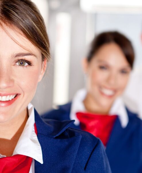 Cabin crew professionals in airline uniform — top cabin crew training courses at Neerja School of Aviation Kerala prepare students for global aviation careers