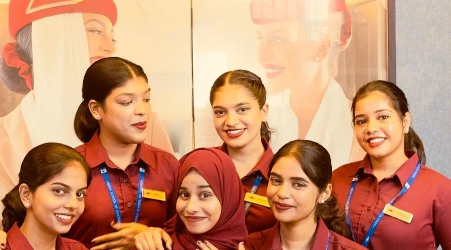 Students in aviation training uniforms posing together during cabin crew and aviation course at Neerja Aviation Institute